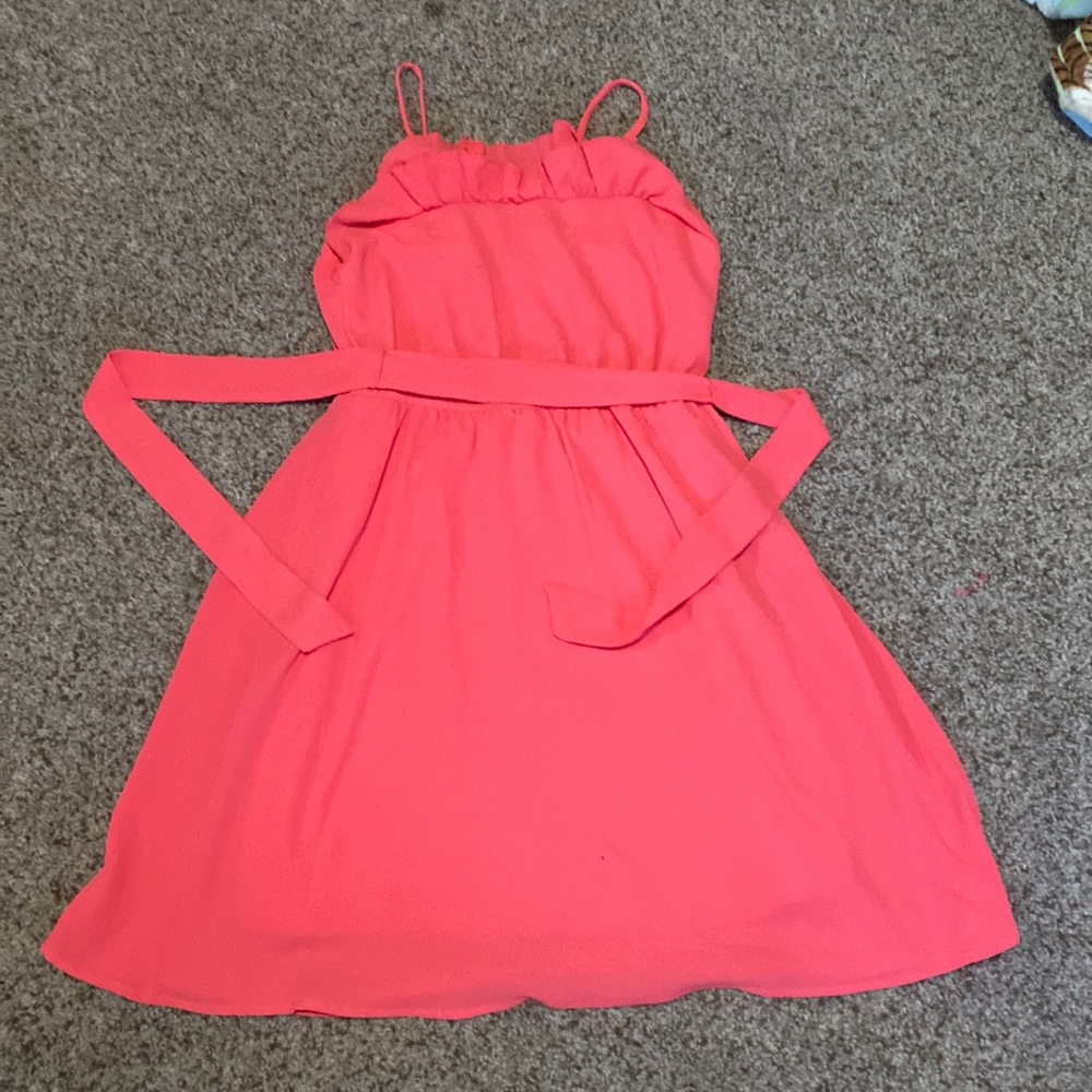 Pinkish orange flowey dress.